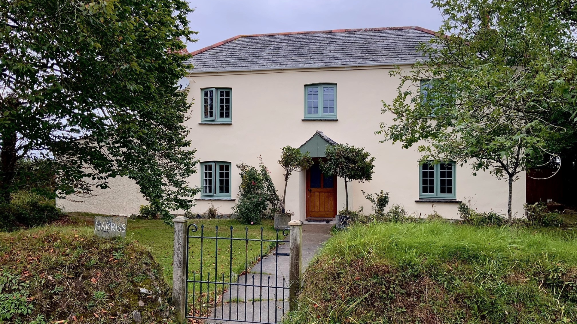 A house with k-rend render that has been painted with masonry paint